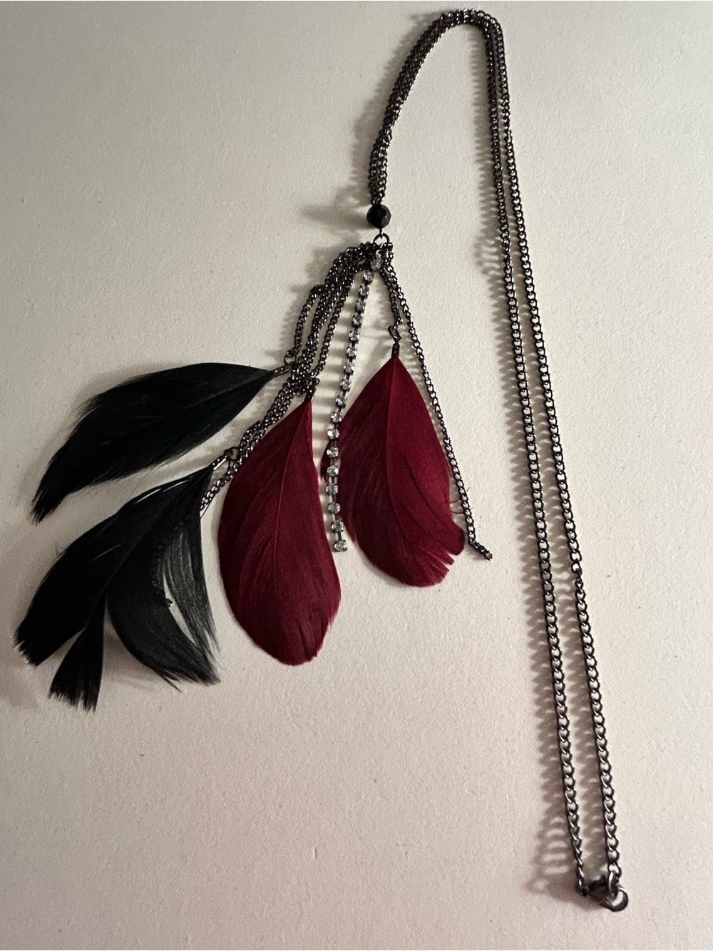NWOT Necklace black & wine red feathers, pronged crystals, gunmetal chains 37”